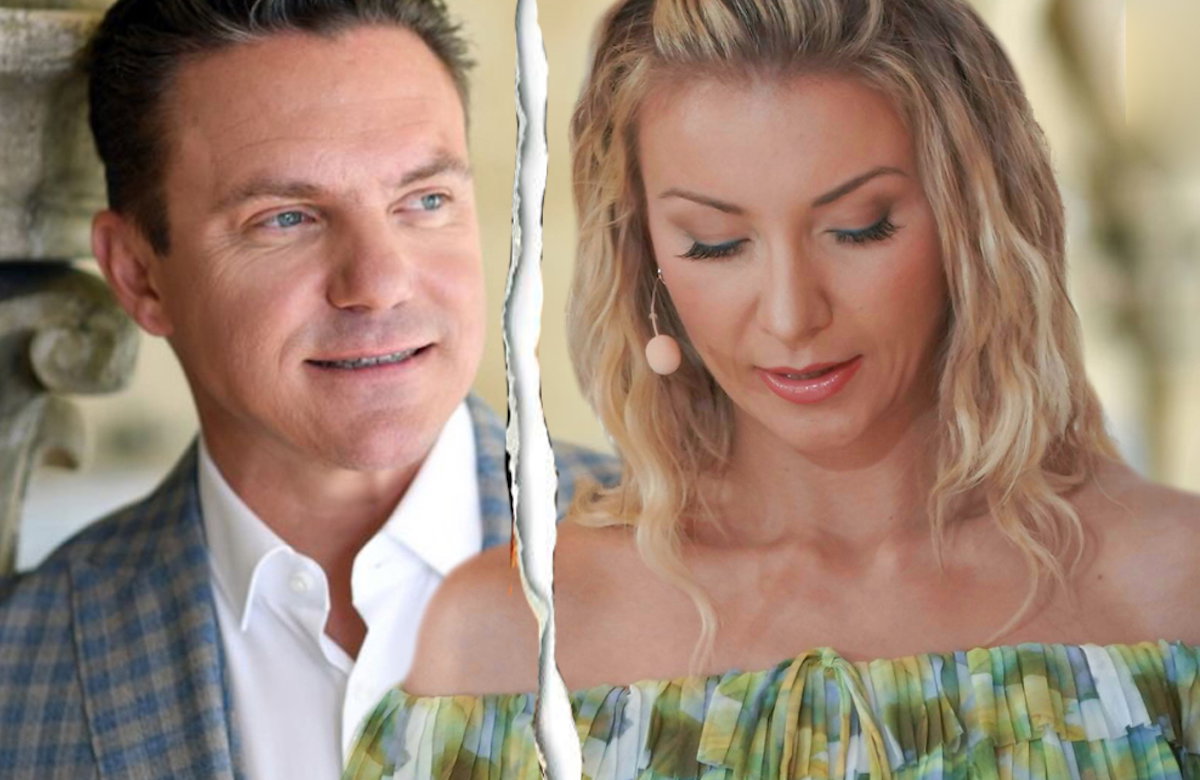 Stefan Mross steht an Steinmauer und lächelt, Anna-Carina Woitschack guckt traurig nach unten