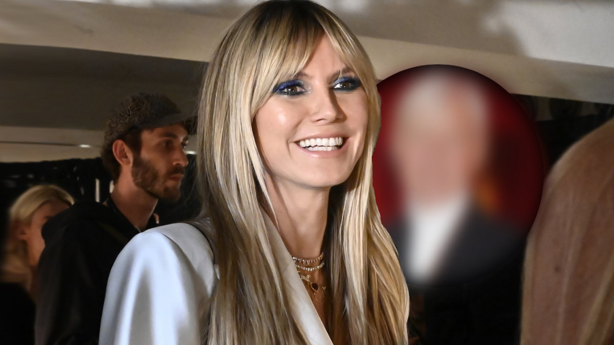 Heidi Klum strahlt vor Glück, neben ihr ist ein verschwommenes Gesicht zu sehen
