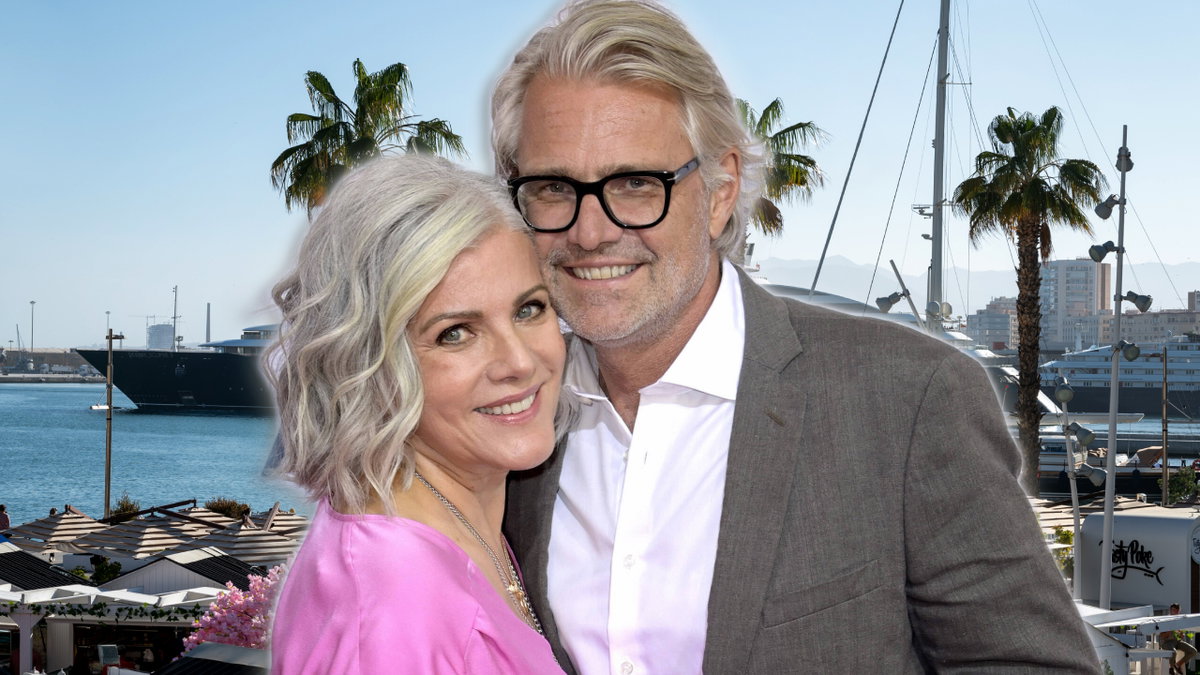 Birgit Schwange und Frank Spothelfer stehen vor Urlaubskulisse