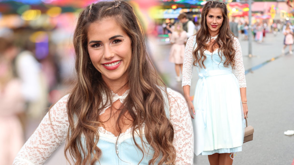 Sarah Engels trägt Dirndl beim Oktoberfest und lächelt