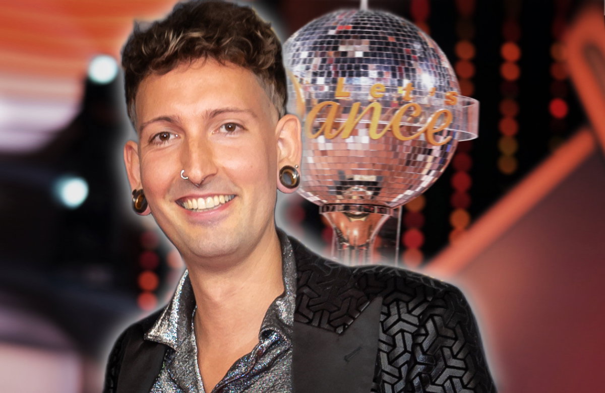 Fabian Kahl lächelt, im Hintergrund steht der "Let's Dance"-Pokal