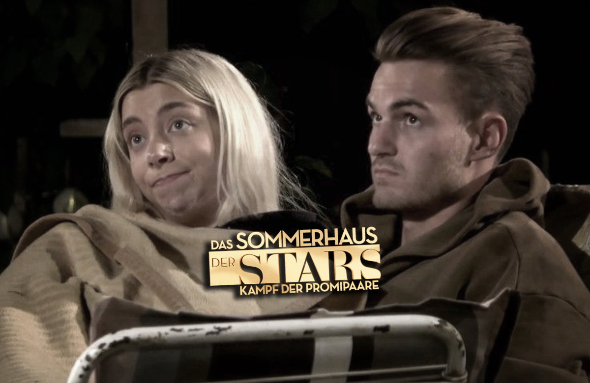 Walentina Doronina und Can Kaplan im "Sommerhaus der Stars" mit Sendungslogo