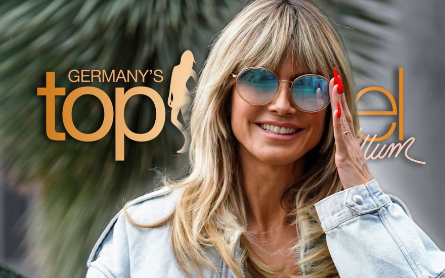 Heidi Klum mit Sonnenbrille vor GNTM-Logo