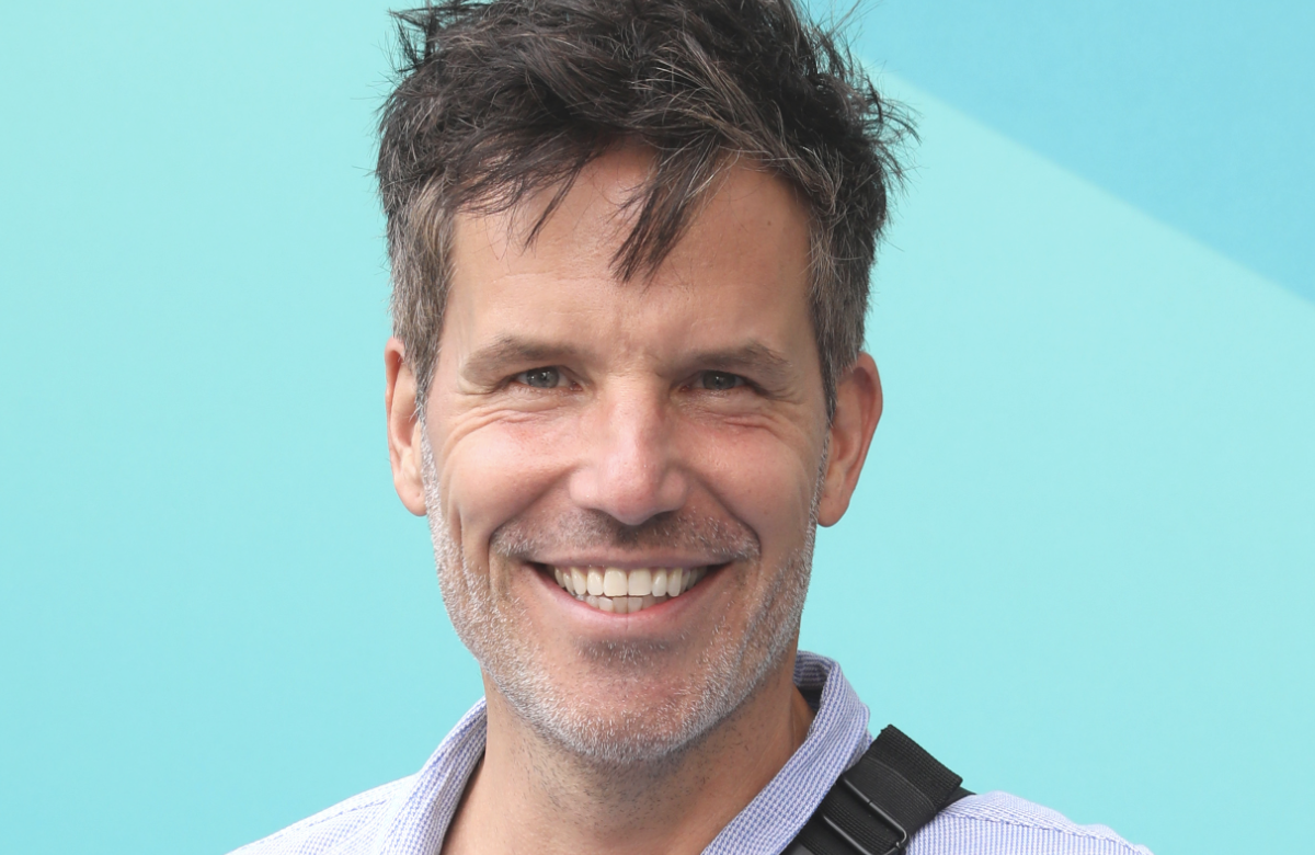 Tim Bergmann lächelt