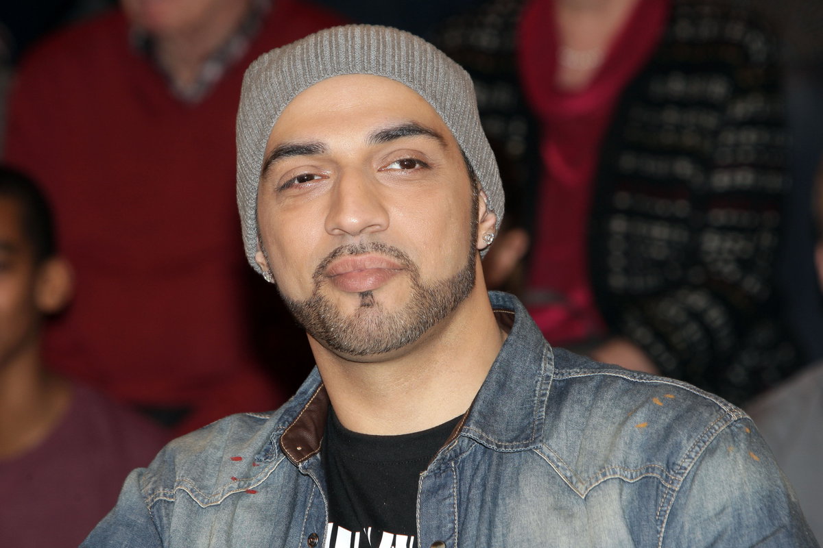 Mehrzad Marashi mit Mütze
