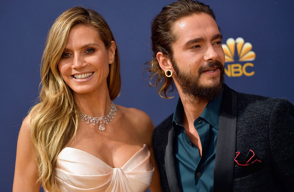 Heidi Klum und Tom Kaulitz lächelnd nebeneinander.