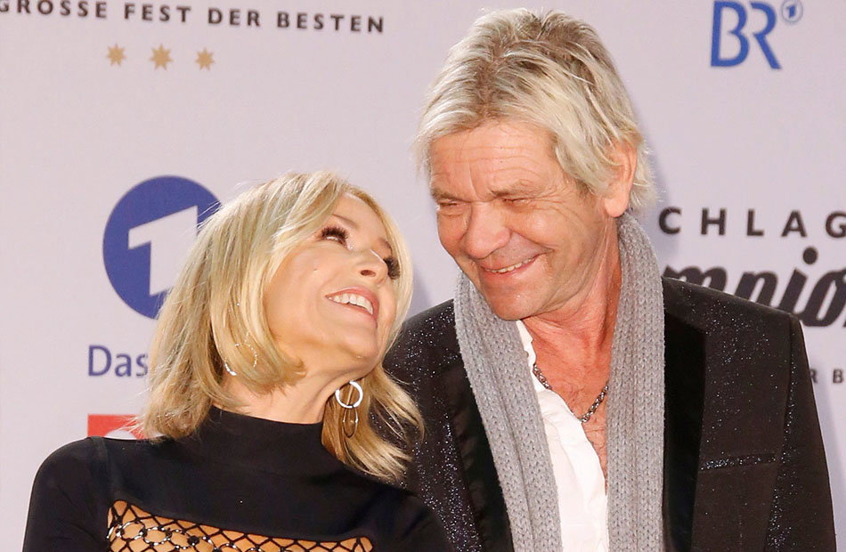 Michelle und Matthias Reim schauen und lächeln sich an